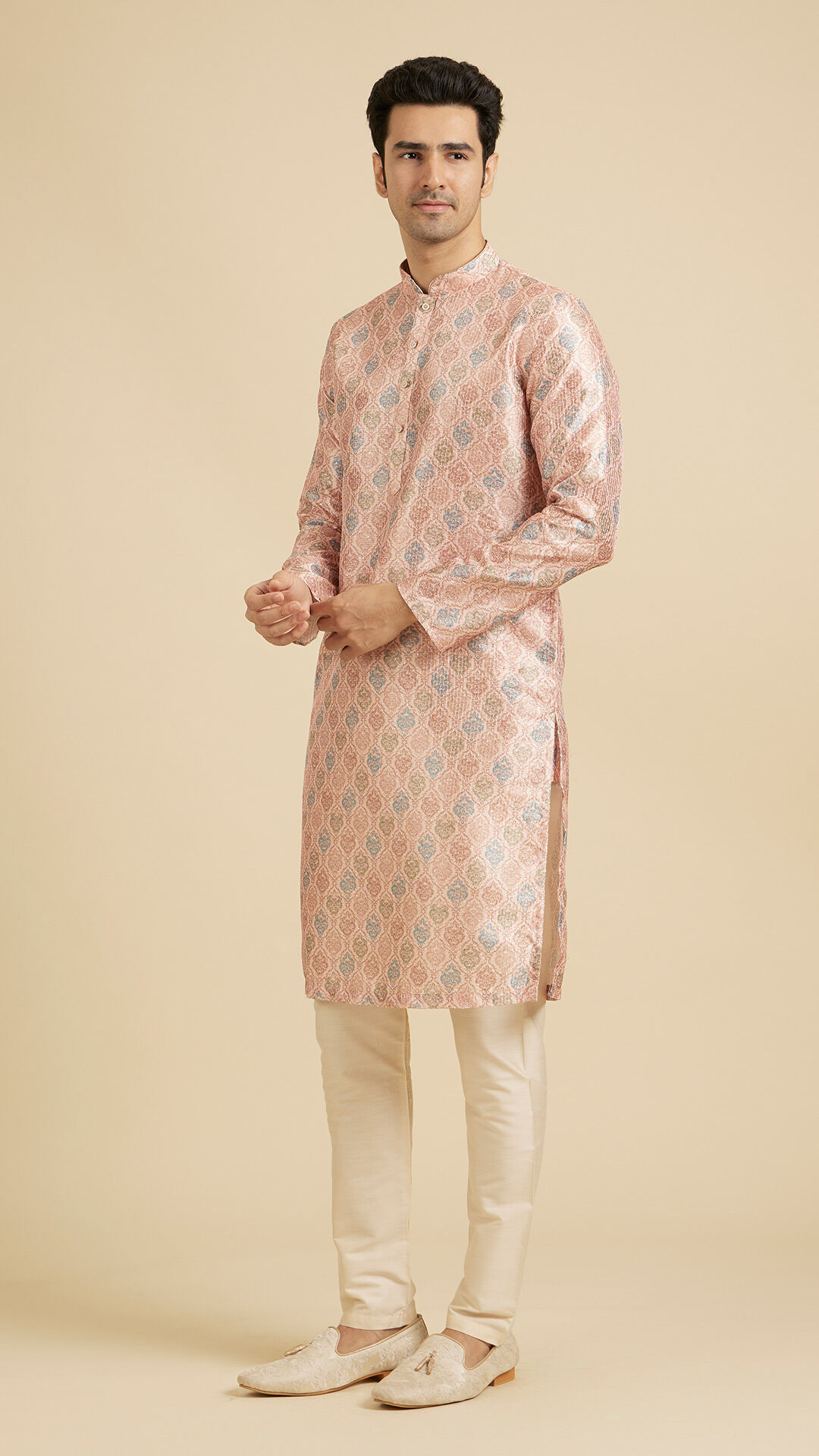 Men flaunting his Peach floral kurta pajama set for wedding